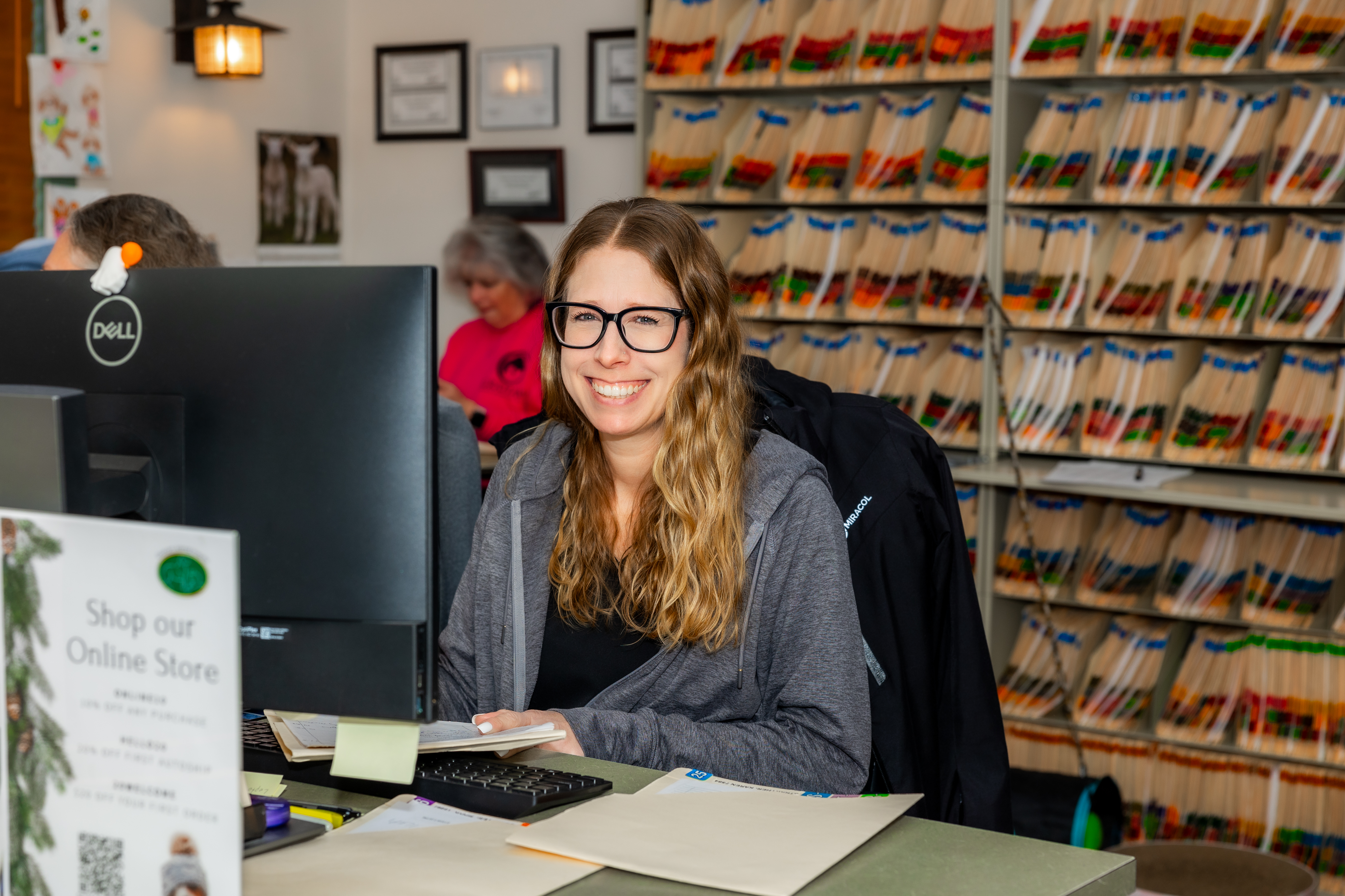Receptionist smiling at front desk